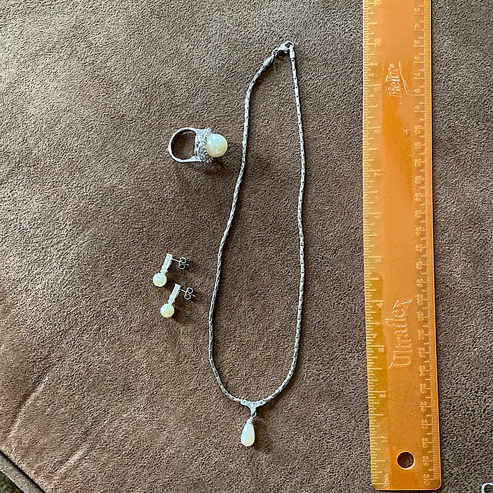 Silver and Pearl necklace earring and ring set.